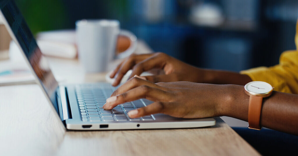 Brand SERP strategy - woman using laptop to search products