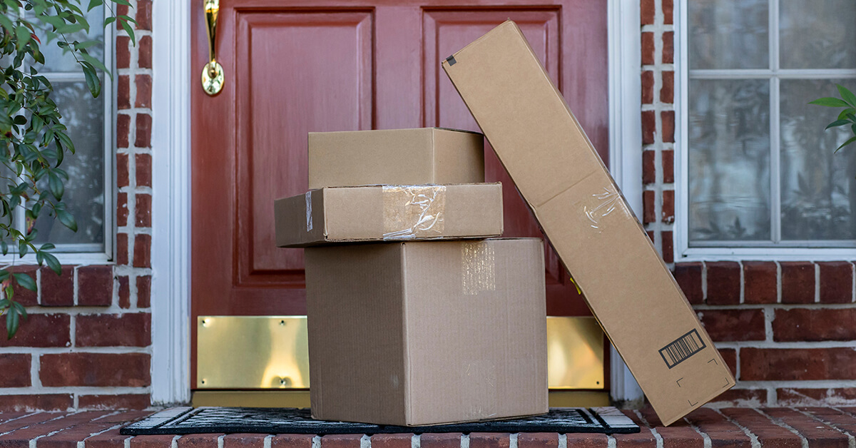 Buy with Prime delivery - packages at the front door of a house