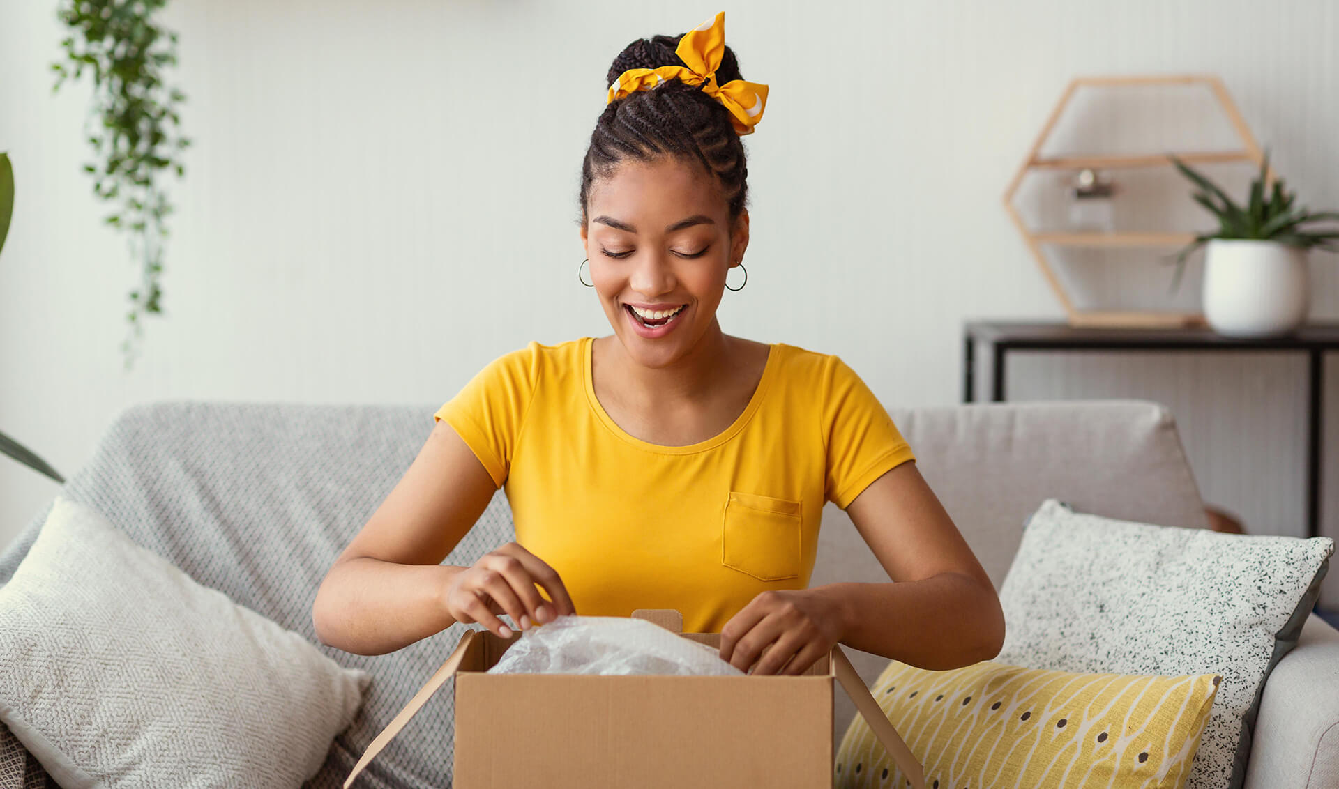 Young woman opening a box from an eCommerce marketplace